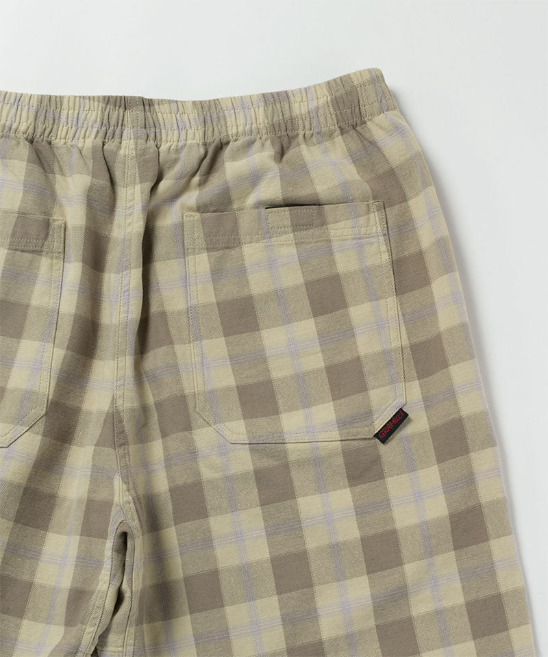 Back view close-up of shadow plaid colored Gramicci Swell Short Shadow Plaid on a light-tone background.
