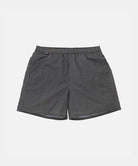 Black Gramicci Grid Swim Short with a belt against a light-tone background.