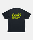 Back view of a Gramicci vintage black Running Man Tee with graphic against a light tone background.

