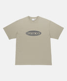 Gramicci beige Outdoor Gear Tee with a grey graphic against a light-tone background.