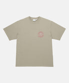 Gramicci beige Running Man Tee with graphic against a light tone background.
