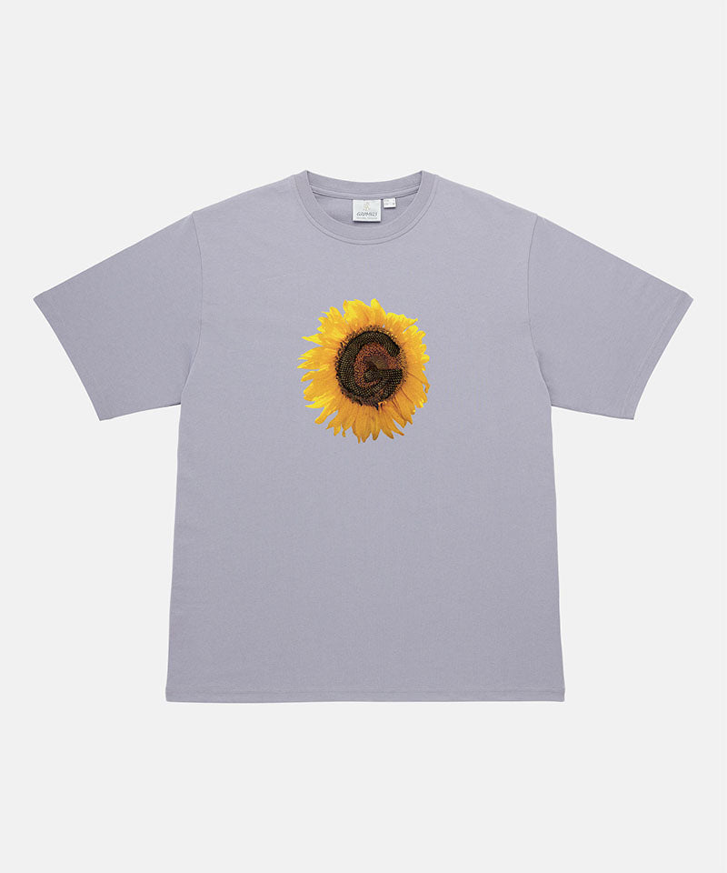 Gramicci lavender G-Flower Tee with sunflower graphic against a light tone background.