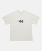 Gramicci natural colored G-Scribble Tee Pigment Dyed shirt with a purple graphic against a light tone background.
