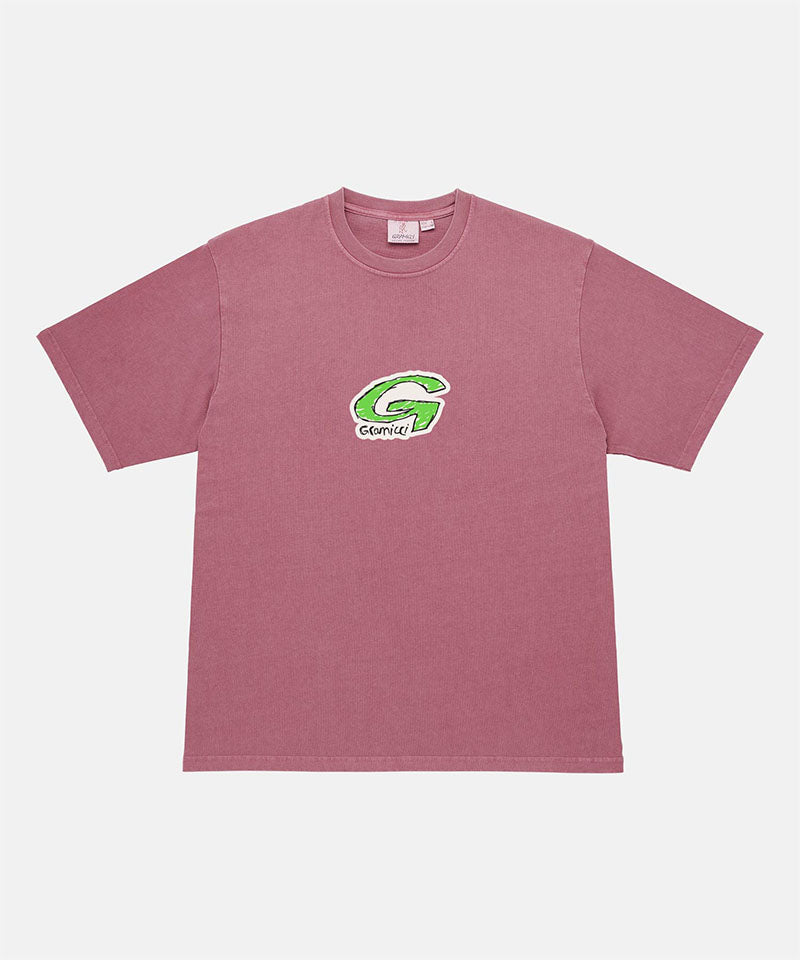 Gramicci red G-Scribble Tee Pigment Dyed shirt with a green graphic against a light tone background.

