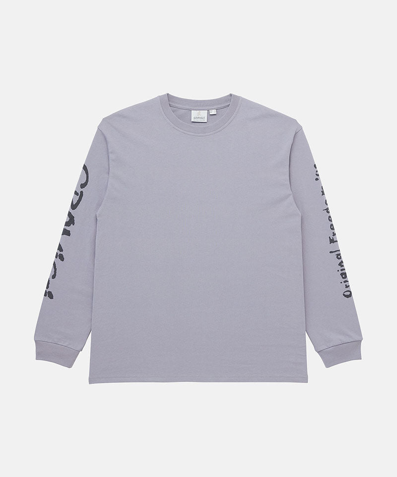 Gramicci lavender Freedom L/S Tee with black graphic on sleeves against a light tone background.
