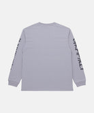 Back view of a Gramicci lavender Freedom L/S Tee with black graphic on sleeves against a light tone background.

