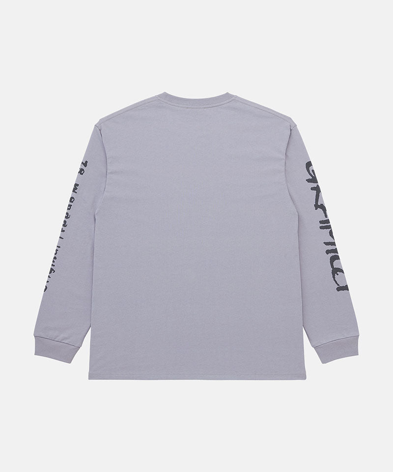 Back view of a Gramicci lavender Freedom L/S Tee with black graphic on sleeves against a light tone background.
