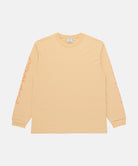 Gramicci mango colored Freedom L/S Tee with dark mango colored graphic on sleeves against a light tone background.
