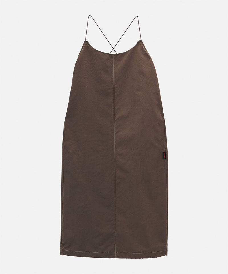 Model wearing a Gramicci Women's Woven Milton Dress in the color walnut on a light-tone background.
