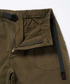 Close-up view of bark pigment colored Gramicci Women's Brooks Pants on a light-tone background.