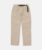 Sand pigment colored Gramicci Women's Brooks Pants with a belt against a light-tone background.