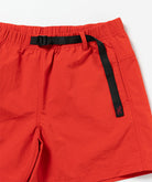 Close-up of Gramicci Women's Nylon Active Short in the color burnt orange against a light-tone background.
