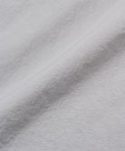 Gramicci ecru colored Nylon Utility Skirt fabric swatch.