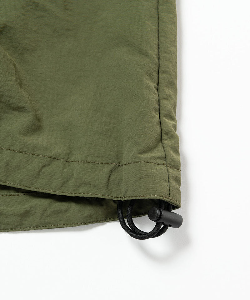 Gramicci olive Nylon Packable Midi Skirt hem detail with drawstring against a light-tone background.