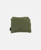 Gramicci olive Nylon Packable Midi Skirt in carrying pouch against a light-tone background.