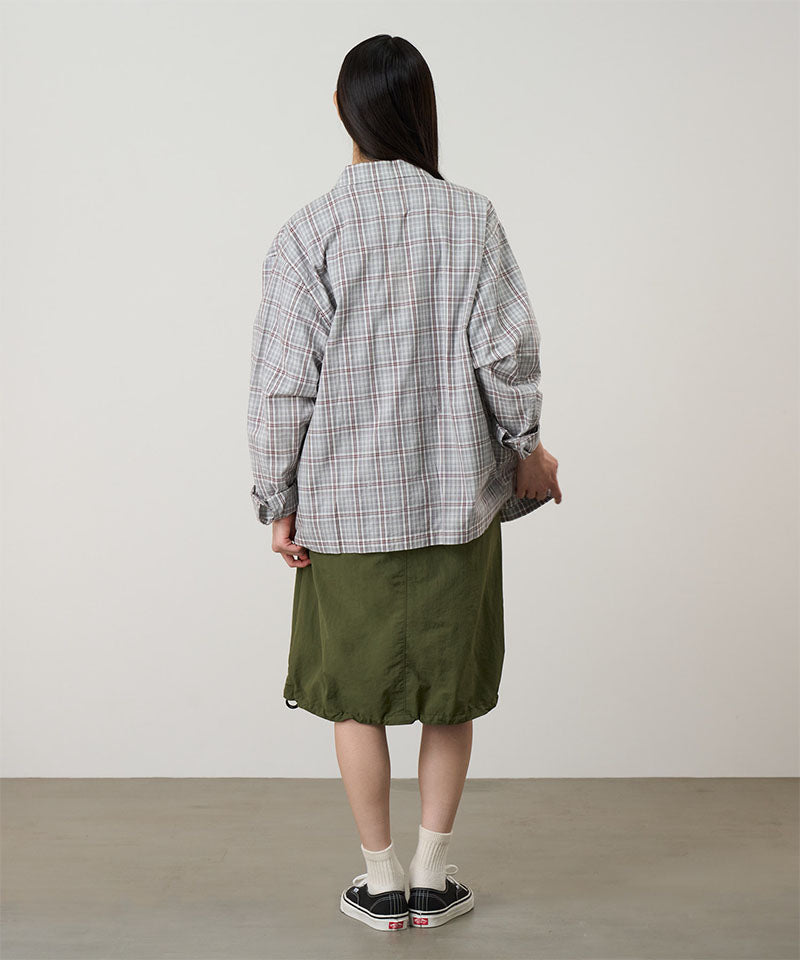 Back view of a model wearing a Gramicci olive Nylon Packable Midi Skirt against a light-tone background.