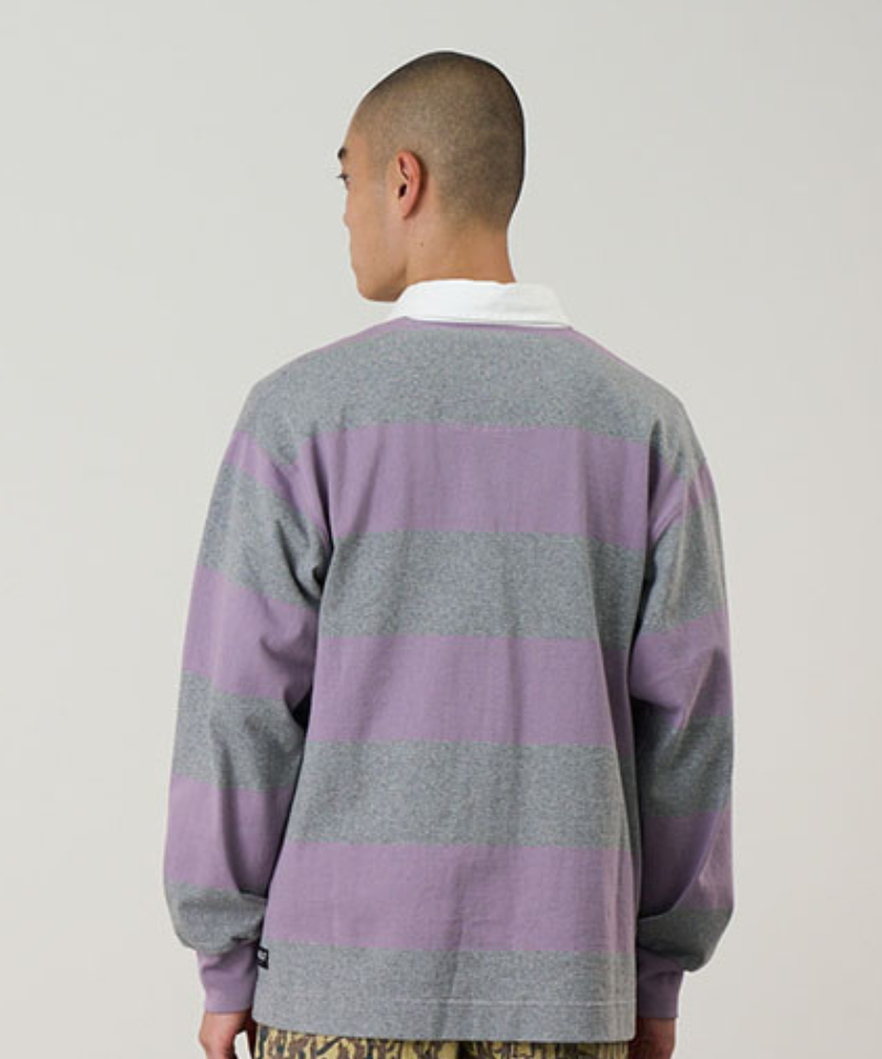 Back view of a model wearing a Gramicci heather and purple stripped Gramicci Langdon Rugby Shirt against a light-tone background.