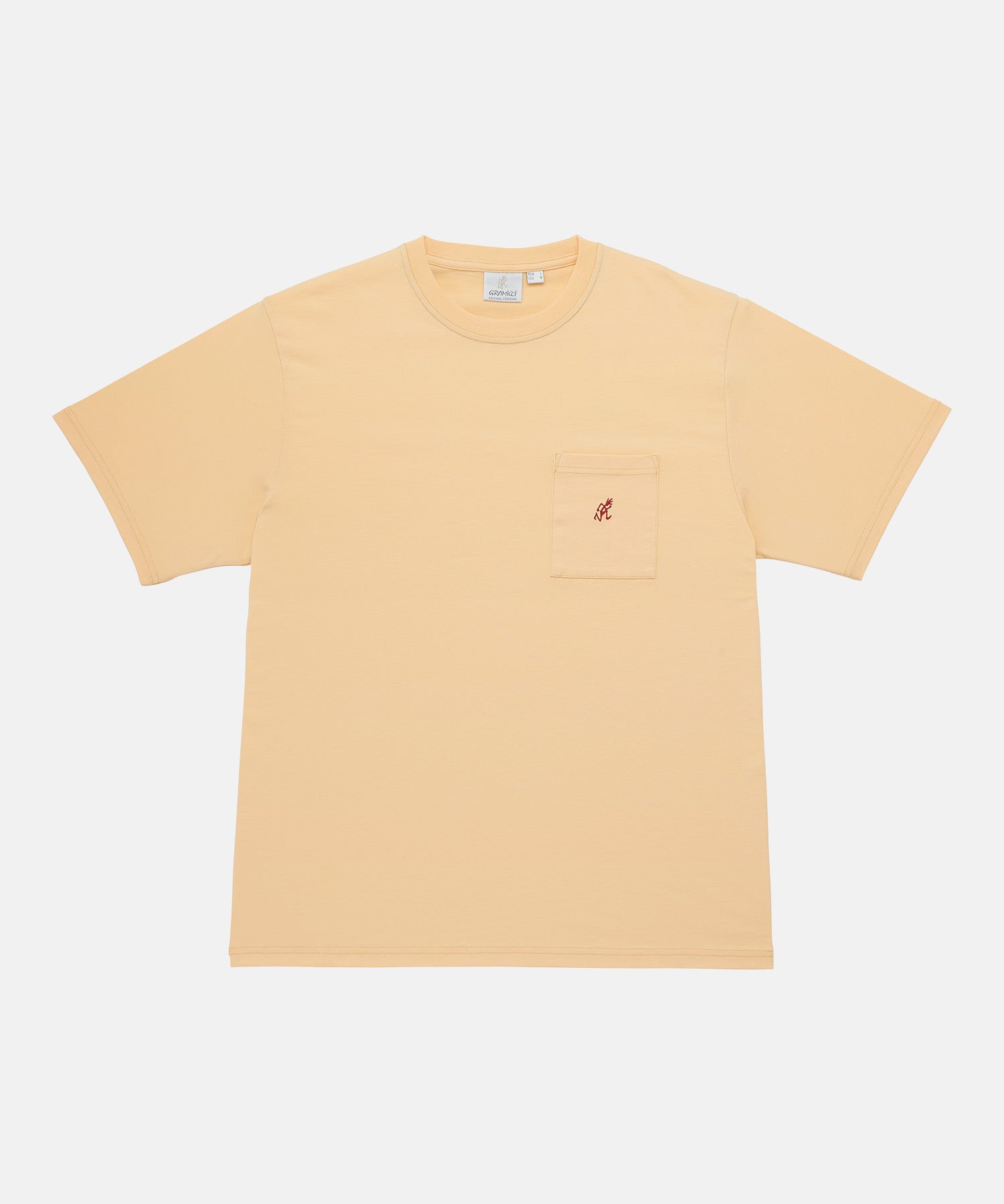 Gramicci mango colored One Point Tee with a small running man graphic against a light-tone background.